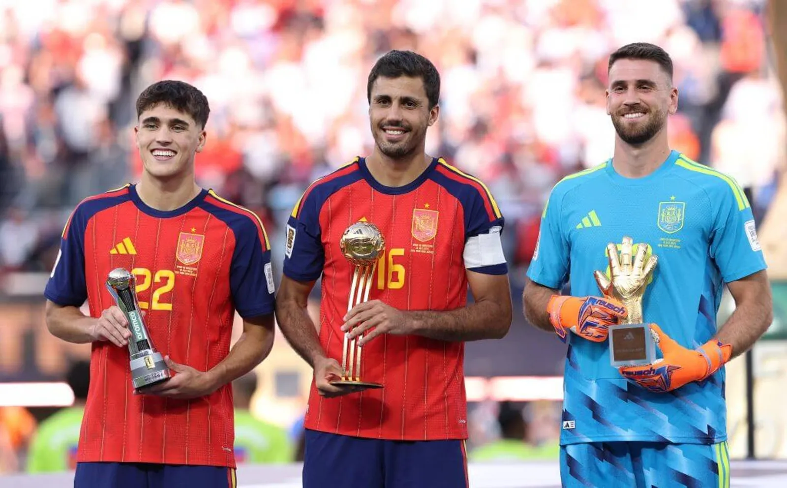 Spain's Rodri flanked by Pau Cubarsi and Unai Simon