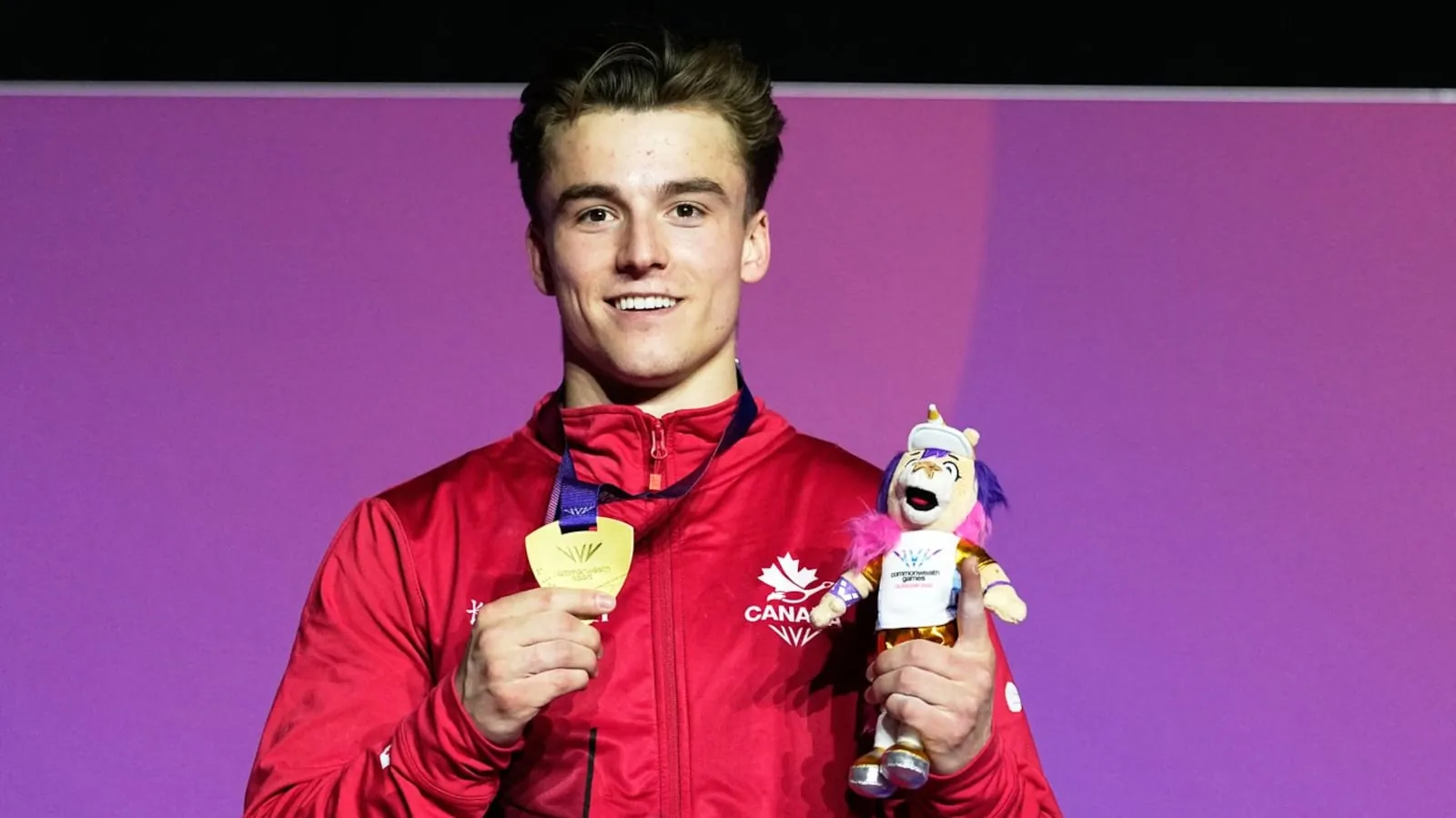 Felix Dolci of Canada poses for a photograph with his gold medal after winning the Men's Vault final of Artistic Gymnastics at the Commonwealth Games in Glasgow, Scotland, Tuesday, July 28, 2026. (AP Photo/Manish Swarup)