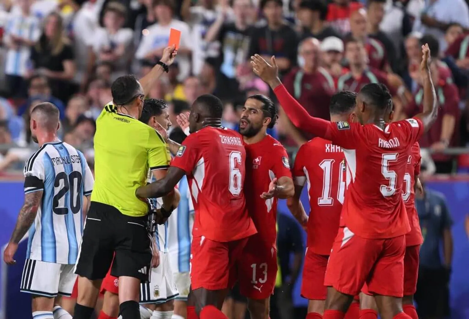 Image of Breel Embolo shown a red card for Switzerland against Argentina