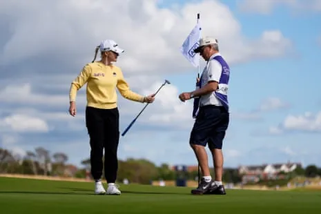 Charley Hull and her caddy, Adam Woodward, on the first day of the Women’s Open