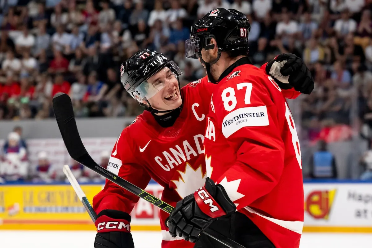 Canada's Sidney Crosby (87) celebrates with Macklin Celebrini (71) after scoring a goal during the third period of the 2026 IIHF Men's Ice Hockey World Championship quarter-final against the United States in Fribourg, Switzerland, earlier this year.Anthony Anex/The Associated Press