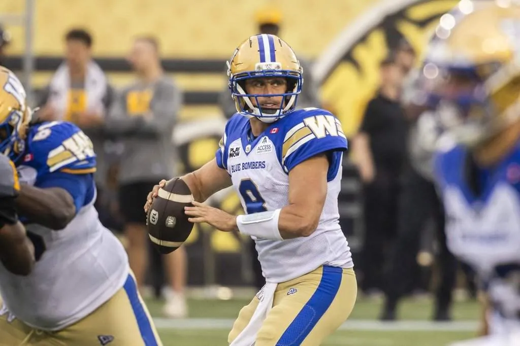 Winnipeg Blue Bombers quarterback Zach Collaros (8) looks for a pass during first half CFL football action against the Hamilton Tiger-Cats, in Hamilton on Sunday, July 5, 2026.