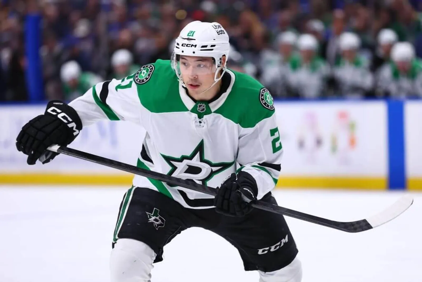 Wearing white Dallas Stars gear, Jason Robertson skates on the ice during an April 2026 game.