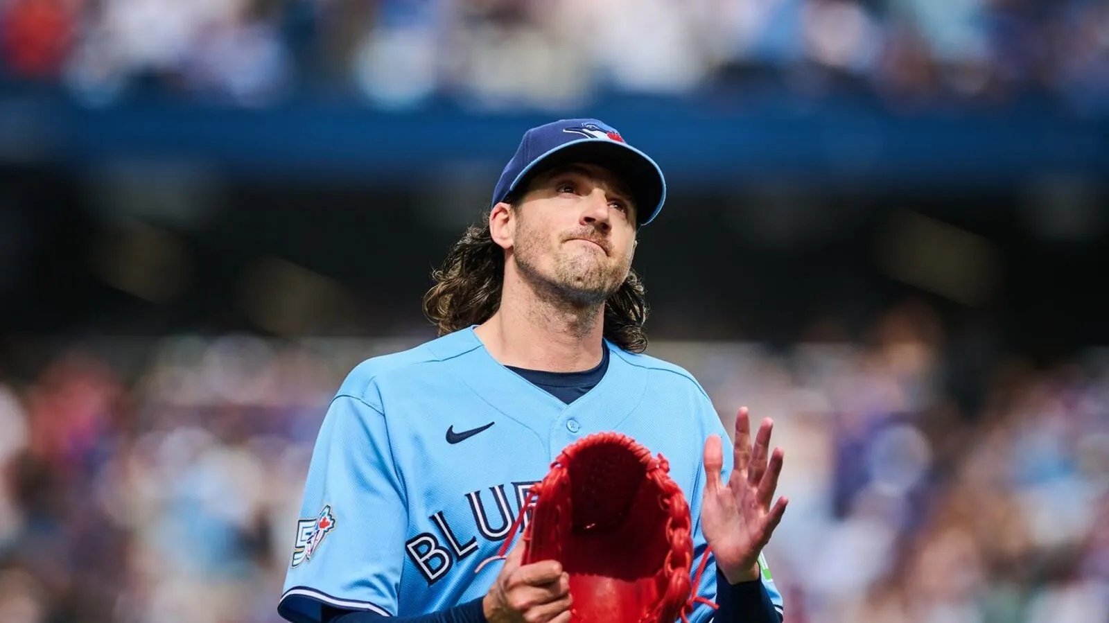 Toronto Blue Jays' Kevin Gausman (34) applauds to the crowd as he is taken out of the game by manager John Schneider during sixth inning MLB action against the St. Louis Cardinals in Toronto, on Saturday, Aug. 1, 2026. THE CANADIAN PRESS/Sammy Kogan